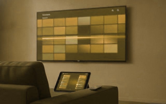 A TV programme guide with a phone and tablet showing channel lists in IPTV player apps
