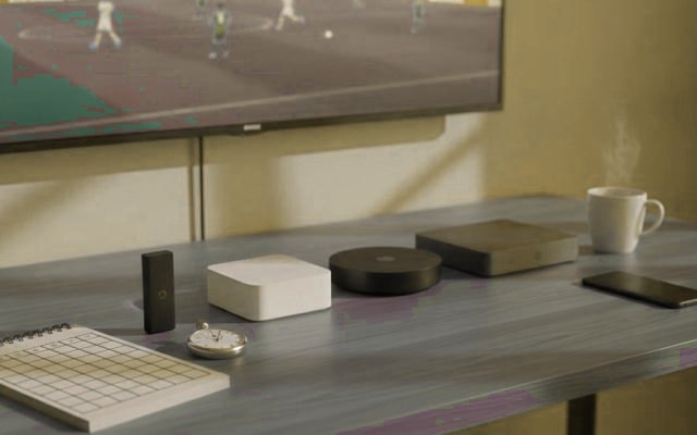Streaming devices and a scoring checklist beside a TV, comparing IPTV services during a free trial